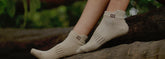 Pair of bamboo fibre socks in soft hues, showcasing breathable knit texture.